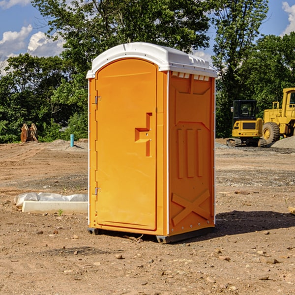 what is the cost difference between standard and deluxe portable restroom rentals in Russell KS